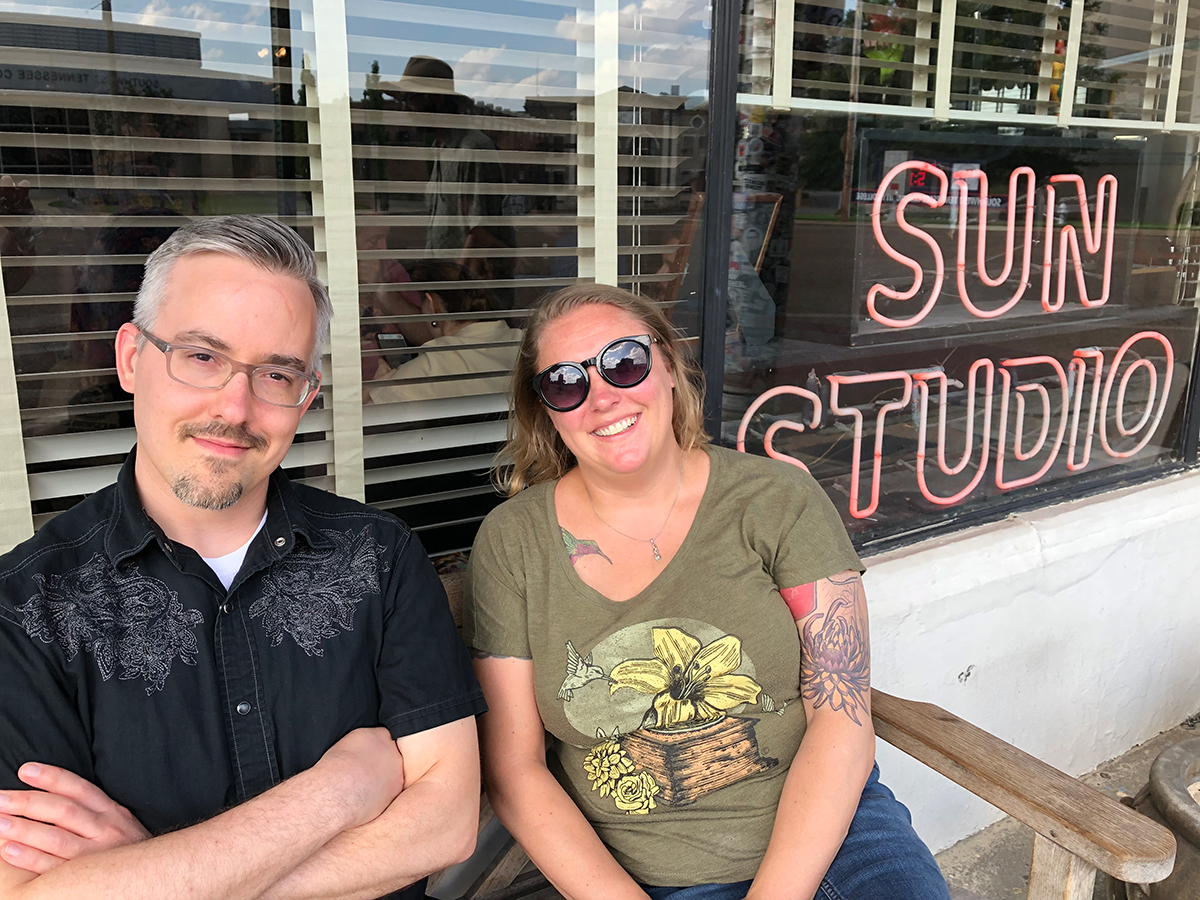 Aaron Rester (left) and Elsbeth Todd of the band Theodosia, in front of a neon sign in the window of Sun Studio